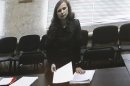 Jailed Pussy Riot punk rock group member Alyokhina is pictured on a monitor inside the courtroom during a hearing in Berezniki