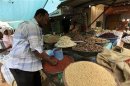 A man looks at food at Khartoum's central food market