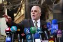 Iraqi Prime Minister Haider al-Abadi gives a press conference on October 20, 2014 in the Iraqi central shrine city of Najaf