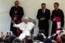 Pope Benedict XVI waves as he visits an old people's home in Rome