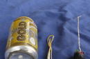A photo published in Islamic State magazine Dabiq shows a can of Schweppes Gold soft drink and what appeared to be a detonator and switch on a blue background