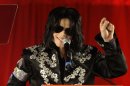 FILE - In this March 5, 2009 file photo, Michael Jackson announces several concerts at the London O2 Arena in July, at a press conference at the London O2 Arena. An AEG Live accounting executive testified Monday, May 20, 2013, in a Los Angeles courtroom that the company spent $24 million on preparations for Jackson’s ill-fated “This Is It” shows, however never paid the singer’s personal doctor convicted of involuntary manslaughter because a fully-signed agreement was never obtained. (AP Photo/Joel Ryan, file)
