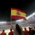 A fan waves a Spain flag before the start of the 2010 World Cup final soccer match at Soccer City stadium