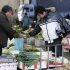 A man buys vegetables at a market Friday Dec. 9, 2011 in Shanghai, China. China's chronically high inflation rate fell to a lower than expected 4.2 percent in November, allowing wider leeway for Beijing to ease credit to support growth. (AP Photo)