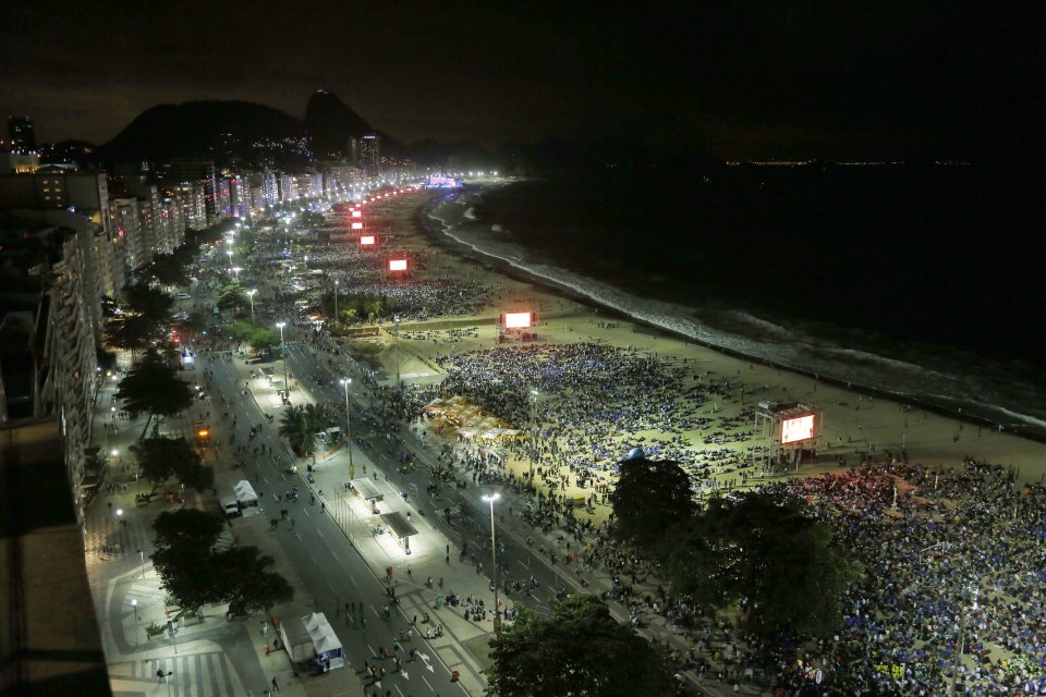 A bird's-eye view of the Copacabana beachfront in Rio de Janeiro, Brazil, Friday, July 26, 2013. Pope Francis presided over one of the most solemn rites of the Catholic Church on Friday, a procession re-enacting Christ's crucifixion, that received a Broadway-like treatment; staging a wildly theatrical telling of the Stations of the Cross, complete with huge stage sets, complex lighting, a full orchestra and a cast of hundreds acting out a modern version of the biblical story. (AP Photo/Jorge Saenz)