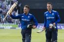 England openers Jason Roy (L) and Alex Hales acknowledge the crowd as they walk from the pitch after batting England to victory in their second ODI match against Sri Lanka, at Edgbaston cricket ground in Birmingham, on June 24, 2016