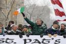 New York Mayor Bill de Blasio, center, waves the flag of Ireland as he marches beside Kerry Kennedy, third from left, during the all-inclusive St. Pat's For All parade in the Sunnyside, Queens neighborhood of New York, Sunday, March 1, 2015. The St. Pat's For All parade, which embraces diversity and inclusion, is considered an alternative to the New York City's official St. Patrick's Day parade on March 17. (AP Photo/Kathy Willens)