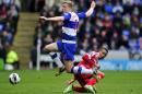 Reading's Russian striker Pavel Pogrebnyak (L) vies with Queens Park Rangers' midfielder Jermaine Jenas (R) during the English Premier League football match between Reading and Queens Park Rangers at the Madejski Stadium in Reading on April 28, 2013