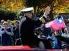 Crowds wave to Navy Capt. Jim Minta as he participates in the 31st annual Veterans Day Parade in downtown Atlanta, Saturday, Nov. 10, 2012. (AP Photo/David Tulis)