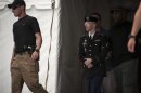 Bradley Manning is escorted out of court after hearing the verdict in his military trial at Fort Meade, Maryland
