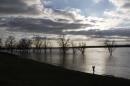 Steve Sands takes pictures of the rising waters in the Mississippi River as flood waters approach their crest in Greenbelt Park in Memphis