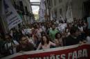 People shout slogans as they march during a protest by Portuguese teachers in Lisbon, Sunday, Oct. 5, 2014. Seven teachers' trade unions organised the march Sunday to protest the government's education policies. (AP Photo/Francisco Seco)