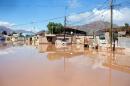 A street flooded by the Copiapo River, which overflowed after heavy rainfall in the city of Copiapo, Chile, March 26, 2015