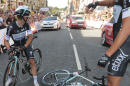 Teammates call for medical assistance after Britain's sprinter Mark Cavendish crashed in the last kilometers of the first stage of the Tour de France cycling race over 190.5 kilometers (118.4 miles) with start in Leeds and finish in Harrogate, England, Saturday, July 5, 2014. (AP Photo/Fred Mons, Pool)