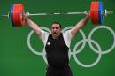 Iran's Behdad Salimikordasiabi competes during the Men's +105kg weightlifting competition at the Rio 2016 Olympic Games in Rio de Janeiro on August 16, 2016