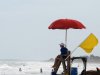 A yellow caution flag waves from a lifeguard stand at Folly Beach, S.C., on Tuesday, May 29, 2012. The National Hurricane Center forecasts the remnants of Tropical Storm Beryl will strengthen and reach tropical storm strength off the South Carolina coast on Wednesday. (AP Photo/Bruce Smith)