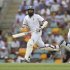 South Africa's Amla and Kallis complete a run as Australia's Ponting looks on, during the first cricket test match at the Gabba in Brisbane
