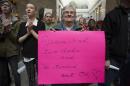 Mary Beth Keidl holds a sign during a rally supporting same-sex marriage at the state capitol in Salt Lake City