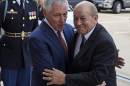 Defense Secretary Chuck Hagel greets French Defense Minister Jean-Yves Le Drian as he arrive for an honor cordon at the Pentagon, Thursday, Oct. 2, 2014. (AP Photo/Susan Walsh)