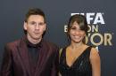 Lionel Messi of Argentina and his wife arrive on the red carpet prior to the FIFA Ballon d'Or 2014 gala held at the Kongresshaus in Zurich, Switzerland, Monday, January 12, 2015. (AP Photo/KEYSTONE,Ennio Leanza)
