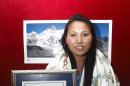 Nepalese woman mountaineer Chhurim who has been recognized by Guinness World Records for climbing Mount Everest twice in the same climbing season poses with the certificate issued to her in Katmandu, Nepal, Monday, Feb. 25, 2013. 29-year-old Chhurim scaled the 8,850-meter (29,035-foot) summit on May 12, 2012, and again a week later on May 19. (AP Photo)