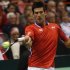 Serbia's Novak Djokovic hits a return to Sam Querrey of the U.S. during their Davis Cup singles quarter-final match in Boise