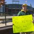 Green Bay Packers fan Mike LePak holds a sign in front of Lambeau Field on Lombardi Avenue, Tuesday, Sept. 25, 2012, in Green Bay, Wis., in protest of a controversial call in the Packers 14-12 loss to the Seattle Seahawks, Monday night in Seattle. Just when it seemed that NFL coaches, players and fans couldn't get any angrier, along came a fiasco that trumped any of the complaints from the weekend. (AP Photo/Mike Roemer)