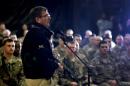 U.S. Defense Secretary Ash Carter speaks with U.S. military personnel at Kandahar Airfield in Afghanistan, Sunday, Feb. 22, 2015. Carter is making his first trip to visit troops and commanders in Afghanistan since his swearing-in this week. (AP Photo/Jonathan Ernst, Pool)