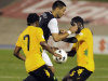 United States' Clint Dempsey, center, is challenged by Jamaica's Jason Morrison, left, and Jevaughn Watson during a 2014 World Cup qualifying soccer match in Kingston, Jamaica, Friday, Sept. 7, 2012. (AP Photo/Collin Reid)