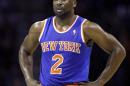 In this Friday, Nov. 8, 2013 photo, New York Knicks guard Raymond Felton catches his breath during a break in the action in an NBA basketball game against the Charlotte Bobcats, in Charlotte, N.C. New York police say Felton has been arrested on three counts of criminal possession of a weapon. Sgt. Thomas Antonetti says Felton turned himself in at 12:50 a.m., Tuesday, Feb. 25, 2014, and was questioned in the 20th Precinct in Manhattan, hours after his team lost at home to the Dallas Mavericks. (AP Photo/Nell Redmond)