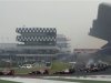 Red Bull Formula One driver Vettel leads on the first turn of the Indian F1 Grand Prix at the Buddh International Circuit in Greater Noida
