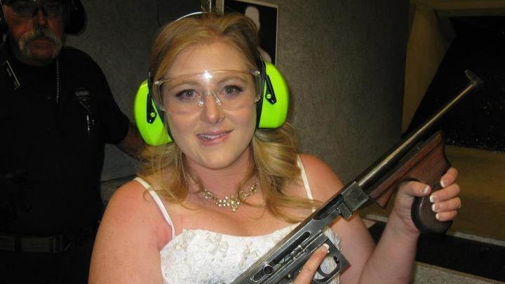  This July 28, 2012 file photo provided by Bob MacDuff shows Lindsae MacDuff holding an automatic weapon at the Gun store in Las Vegas after her "shotgun wedding." Tourists from Japan flock to ranges in Waikiki, Hawaii, and the dozen or so that have cropped up in Las Vegas offer bullet-riddled bachelor parties and literal shotgun weddings, where newly married couples can fire submachine gun rounds and pose with Uzis and ammo belts. (AP Photo/Bob MacDuff, FILE)