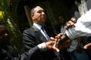 Former Haitian president Jean-Claude Duvalier "Baby Doc" greets people on March 29, 2011 in Port au Prince