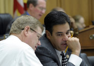 FILE - In this May 22, 2013 file photo, House Judiciary Committee members Rep. Raul Labrador, R-Idaho, right, and Rep. Mark Amodei, R-Nev. talk on Capitol Hill in Washington. House members writing a bipartisan immigration bill said Thursday they had patched over a dispute that threatened their efforts, even as they and the rest of Congress prepared to return home for a weeklong recess where many could confront voter questions on the issue. Republicans in the group want to ensure that those immigrants don’t get taxpayer funded care and could be subject to deportation if they don’t pay their health bills, said Labrador. (AP Photo/Susan Walsh, File)
