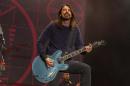 FILE - In this Nov. 2, 2014 file photo, Dave Grohl of the Foo Fighters performs at the Voodoo Music Experience in New Orleans. Grohl managed to finish a concert with a broken ankle, but he can't finish the Foo Fighters tour. The Foo Fighters announced Tuesday, June 16, 2015, that they're canceling the rest of their European tour after Grohl was injured in fall on stage in Sweden on Friday, June 12. (Photo by Barry Brecheisen/Invision/AP, File)