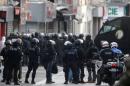 Members of French special police forces of the Research and Intervention Brigade are seen near a raid zone in Saint-Denis, near Paris