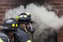 Firefighters put out a live fire during an experiment on Governors Island, in New York