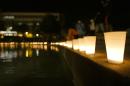 Candles line a wall around a reflection pond at the University of Central Florida to honor Steven Sotloff