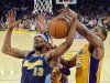 Denver Nuggets forward Corey Brewer, left, and Los Angeles Lakers forward Metta World Peace grapple for the ball during the first half of Game 7 in their first-round NBA basketball playoff series, Saturday, May 12, 2012, in Los Angeles. (AP Photo/Mark J. Terrill)