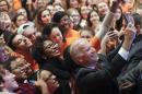 Vice President Joe Biden poses for a selfie with students at Syracuse University after speaking during an "It's On Us" event to raise awareness of sexual assault on college campuses, Thursday, Nov. 12, 2015, in Syracuse, N.Y. (AP Photo/Mike Groll)