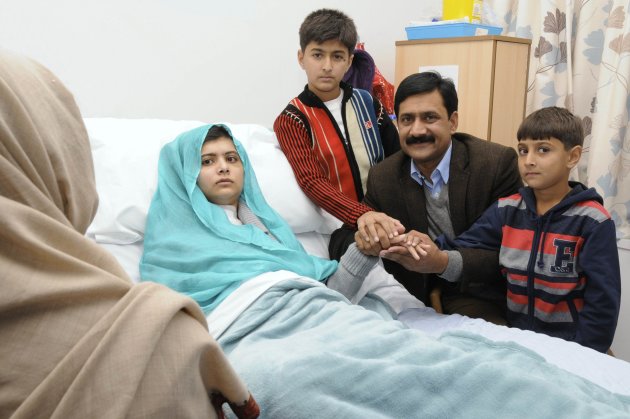 Malala Yousufzai is seen with her father Ziauddin and her two younger brothers Khushal Khan and Atal Khan (R), as she recuperates at the The Queen Elizabeth Hospital in Birmingham, in this photograph taken October 25, 2012 and released October 26, 2012. The father of a Pakistani girl who was shot in the head by the the Taliban for advocating girls' education said on Friday his daughter was strong and would "rise again" to pursue her dreams after receiving treatment in a British hospital. REUTERS/Queen Elizabeth Hospital Birmingham/Handout  (BRITAIN - Tags: HEALTH CRIME LAW POLITICS) NO COMMERCIAL OR BOOK SALES. FOR EDITORIAL USE ONLY. NOT FOR SALE FOR MARKETING OR ADVERTISING CAMPAIGNS. THIS IMAGE HAS BEEN SUPPLIED BY A THIRD PARTY. IT IS DISTRIBUTED, EXACTLY AS RECEIVED BY REUTERS, AS A SERVICE TO CLIENTS. NO THIRD PARTY SALES. NOT FOR USE BY REUTERS THIRD PARTY DISTRIBUTORS