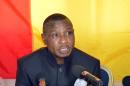 Guinea's former military ruler Captain Moussa Dadis Camara holds a press conference on May 11, 2015, from Ouagadougou, to announce his intention to run for the upcoming 2015 Guinean presidential election