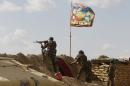 Shi'ite fighters clash with Islamic State militants at Udhaim dam, north of Baghdad