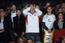 Rugby fans react after watching the Pool A match of the 2015 Rugby World Cup between England and Australia at the official Fanzone at Twickenham stadium, south west London on October 3, 2015