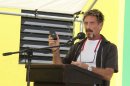 FILE - In this Nov. 8, 2012 file photo, John McAfee speaks at a ceremony for the official presentation of equipment at the San Pedro Police Station in Ambergris Caye, Belize. McAfee, 67, has been identified as a 