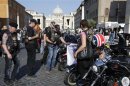 Harley-Davidson bikers gather outside Saint Peter's Square in Rome