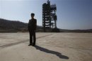 A soldier stands guard in front of the Unha-3 (Milky Way 3) rocket sitting on a launch pad at the West Sea Satellite Launch Site, during a guided media tour by North Korean authorities in the northwest of Pyongyang