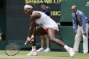 Serena Williams of the United States follows through on a return during her Women's singles match against Sabine Lisicki of Germany at the All England Lawn Tennis Championships in Wimbledon, London, Monday, July 1, 2013. (AP Photo/Alastair Grant)