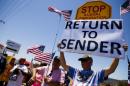 Demonstrators picket against the possible arrivals of undocumented migrants who may be processed at the Murrieta Border Patrol Station in California