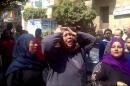 This image made from video shows relatives reacting after an Egyptian court on Monday sentenced to death 529 supporters of ousted Islamist President Mohammed Morsi in connection to an attack on a police station that killed a senior police officer in Minya, Egypt, Monday, March 24, 2014. The convictions came after after two sessions in a mass trial that raised an outcry from rights activists and threatened to spark a violent backlash.(AP Photo via AP video)
